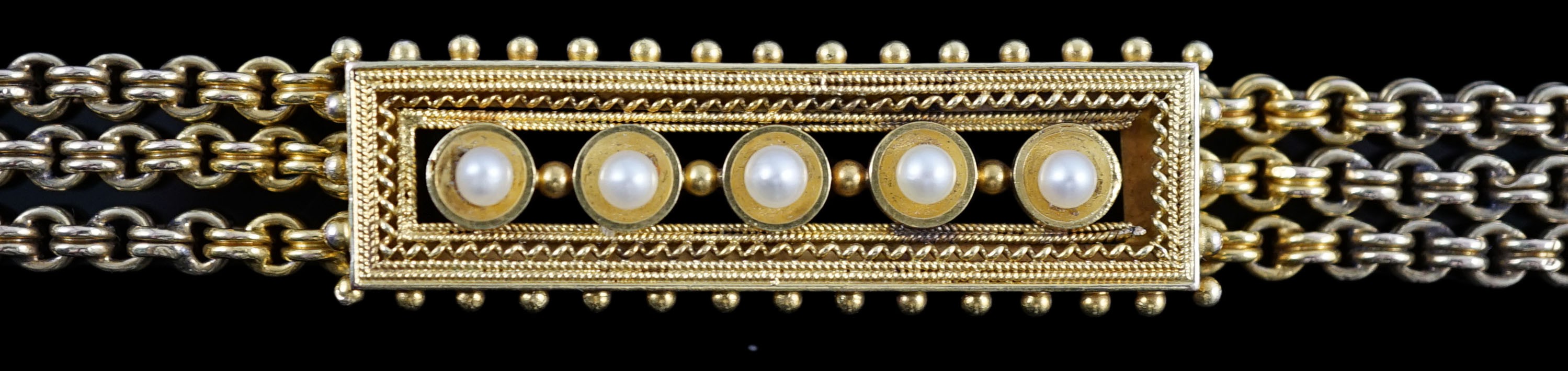 An early 20th century triple strand gold bracelet with central rectangular motif set with five cultured pearls